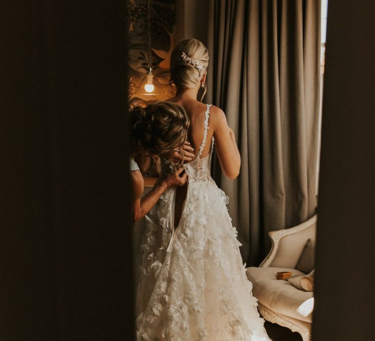 Bride getting ready into her Galia Lahav wedding dress