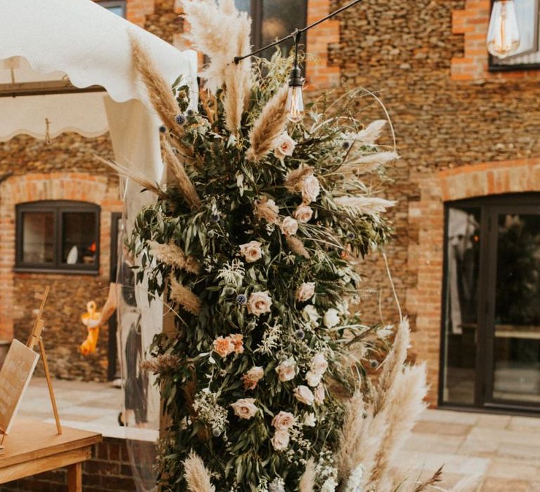 Verticle wedding flower arrangement with pampas grass for August 2020 wedding reception