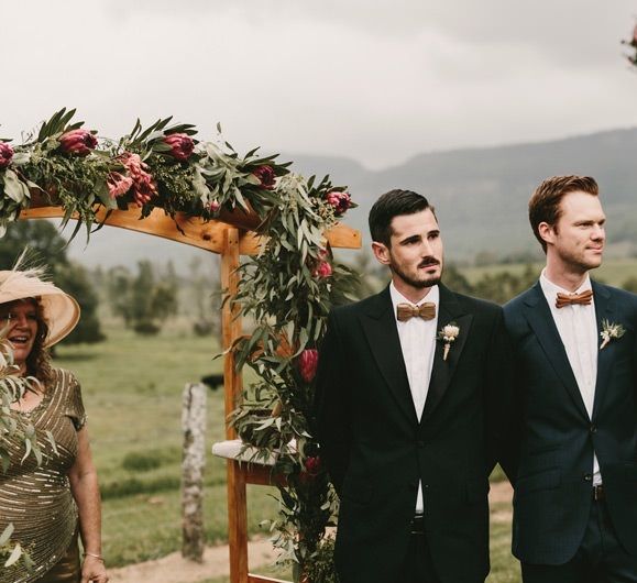 Groomsmen at the Altar in Dark Suits and Wooden Bow Ties