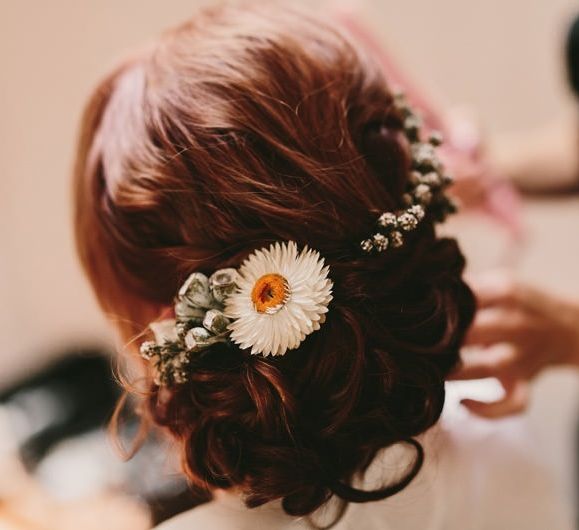 Pinned Bridal Up Do with Fresh Flowers in Her Hair