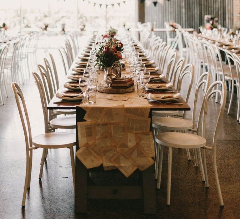 Wedding Reception Decor with Festoon Lights, Book Pages Table Runner and Tree Slice Centrepieces