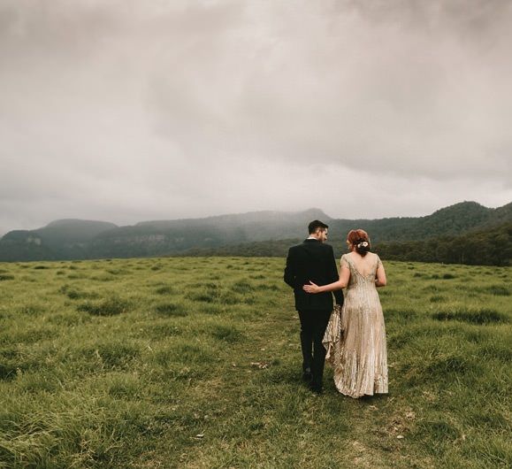 Bride in Sequin Gold Wedding Dress an Groom in Dark Suit with Wood Bow Tie