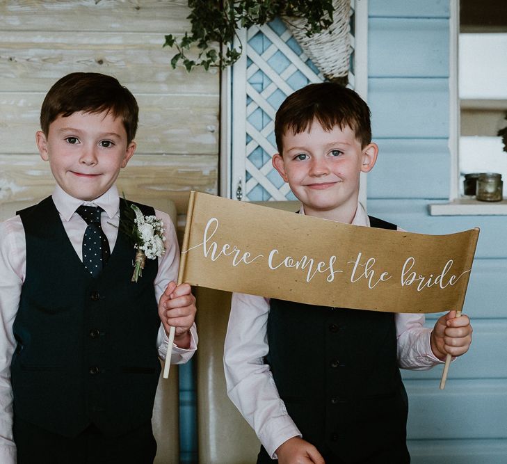 Page Boys with Here Comes The Bride Sign | Lusty Glaze Beach Wedding Newquay Cornwall | Alexa Poppe Photography