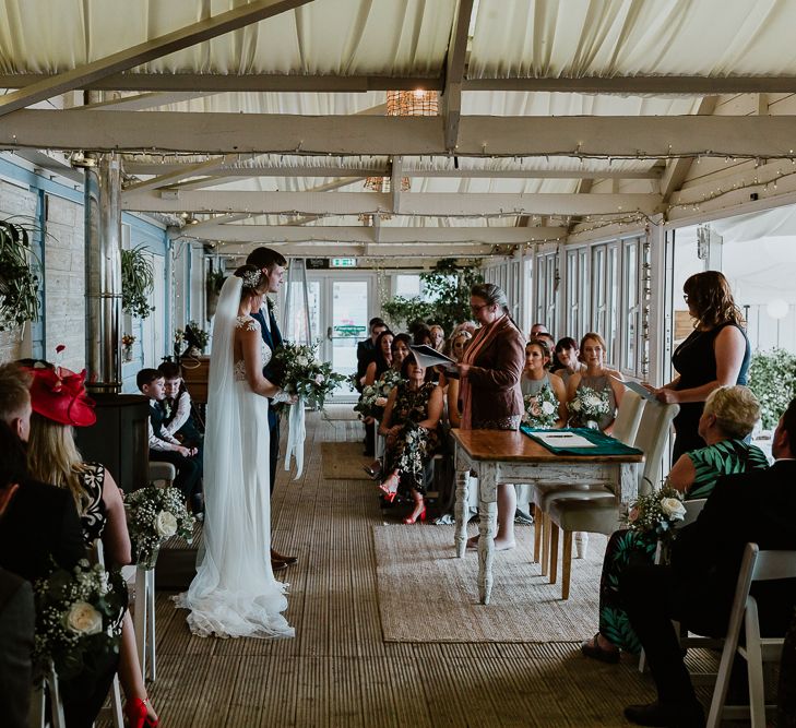 Wedding Ceremony | Bride in Lace Long Sleeve Martina Liana Wedding Dress | Groom in Navy Three-piece Suit | Lusty Glaze Beach Wedding Newquay Cornwall | Alexa Poppe PhotographyLusty Glaze Beach Wedding Newquay Cornwall | Alexa Poppe Photography