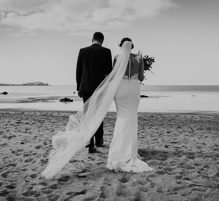 Coastal Portrait | Bride in Lace Long Sleeve Martina Liana Wedding Dress | Groom in Navy Three-piece Suit | Lusty Glaze Beach Wedding Newquay Cornwall | Alexa Poppe PhotographyLusty Glaze Beach Wedding Newquay Cornwall | Alexa Poppe Photography