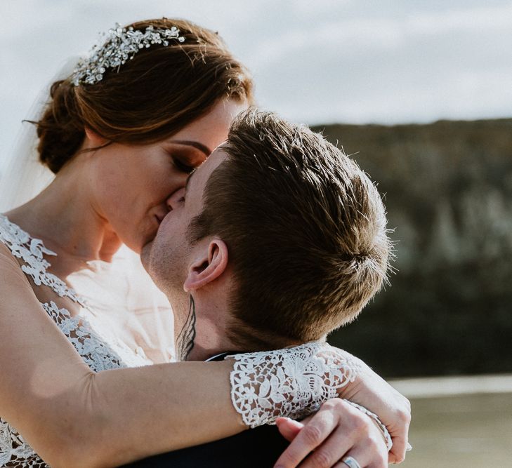 Coastal Portrait | Bride in Lace Long Sleeve Martina Liana Wedding Dress | Groom in Navy Three-piece Suit | Lusty Glaze Beach Wedding Newquay Cornwall | Alexa Poppe PhotographyLusty Glaze Beach Wedding Newquay Cornwall | Alexa Poppe Photography