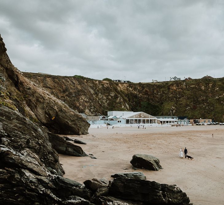 Coastal Portrait | Bride in Lace Long Sleeve Martina Liana Wedding Dress | Groom in Navy Three-piece Suit | Lusty Glaze Beach Wedding Newquay Cornwall | Alexa Poppe PhotographyLusty Glaze Beach Wedding Newquay Cornwall | Alexa Poppe Photography