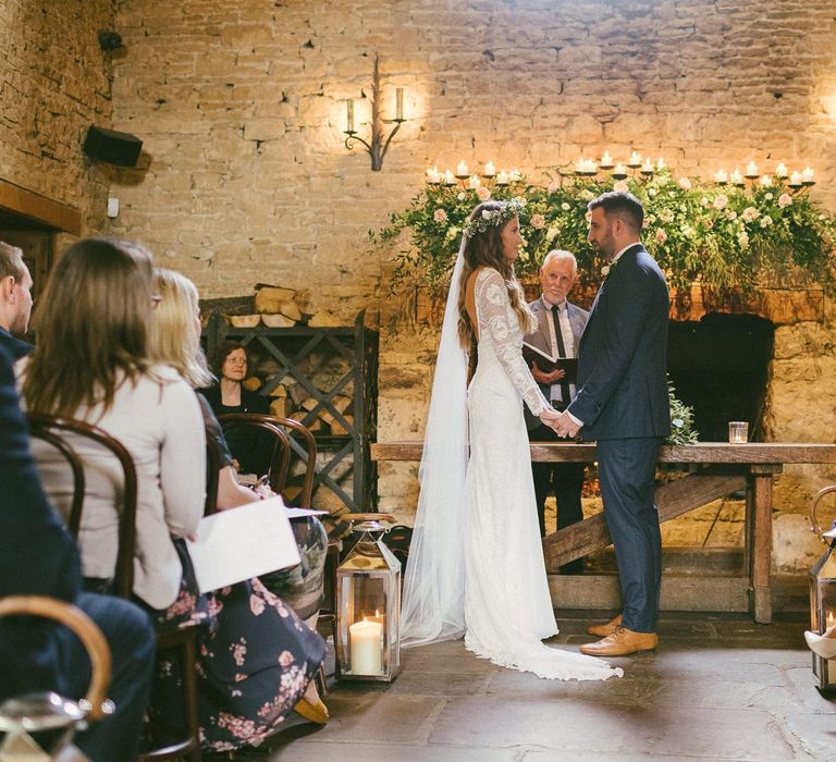 Bride and Groom At Altar With Floral Decoration