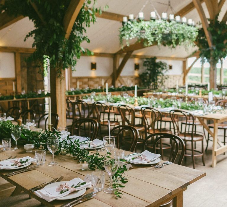 Cripps Barn Wedding Venue Decorated with Foliage and Flowers