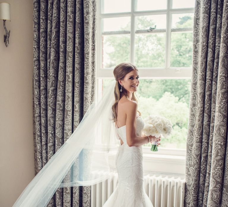 Beautiful Bride in Beaded Fishtail Wedding Dress with Corset Top