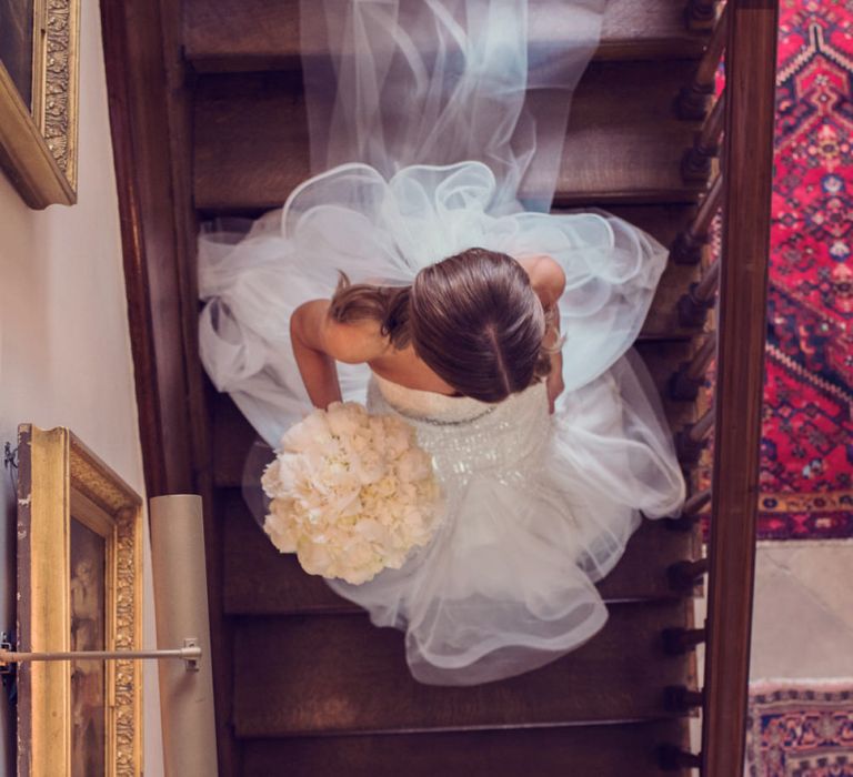 Bride in Beaded Fishtail Wedding Dress Walking Down the Stairs at Iscoyd Park Wedding Venue