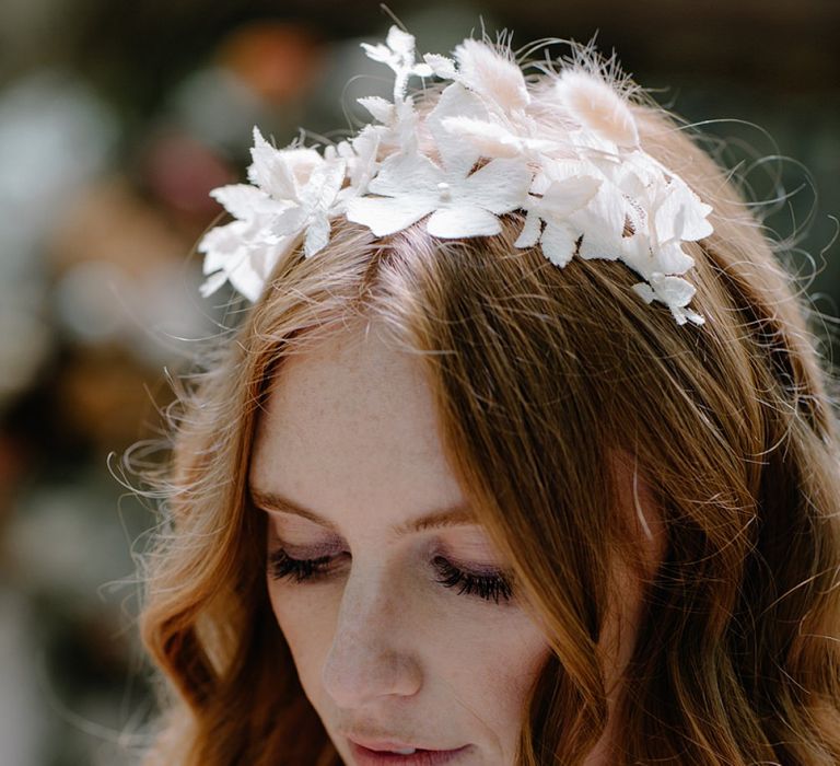 Natural Bridal Makeup with Wavy Hair and Delicate Flower Headdress