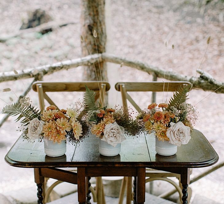 Orange and Dried Grass Wedding Flowers in Vessels