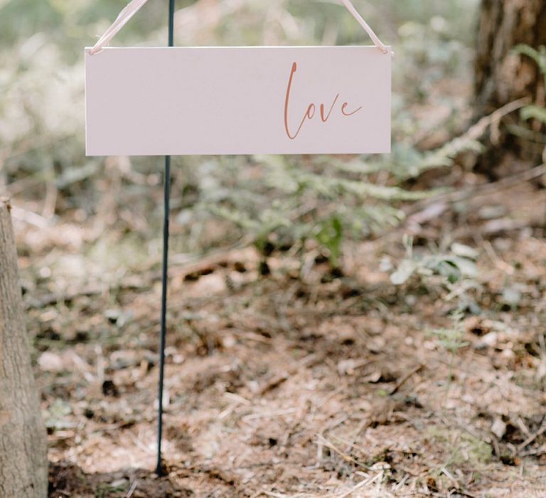 Hanging Love Sign Lining The Aisle