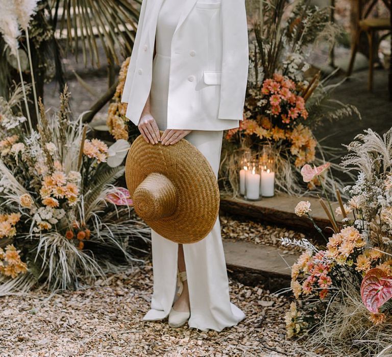 Stylish Bride with Sleek Bun Hairstyle, Fitted Wedding Dress and Blazer