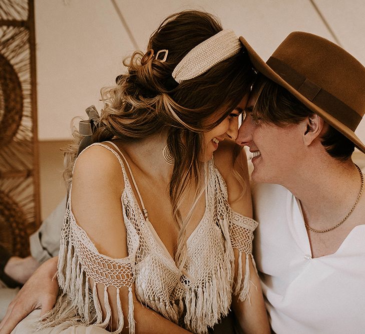 Boho Couple Embracing in a Bell Tent