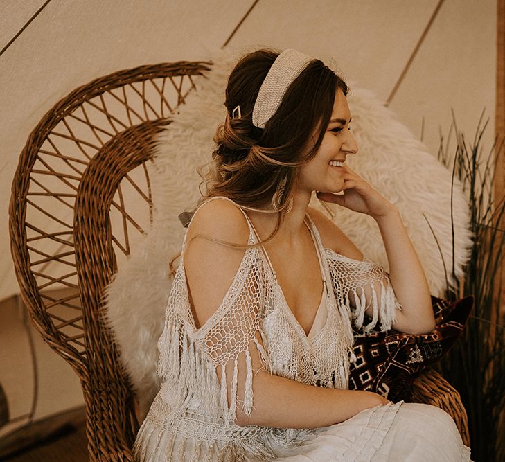 Boho Bride in Fringe Wedding Dress Sitting on a Wicker Chair