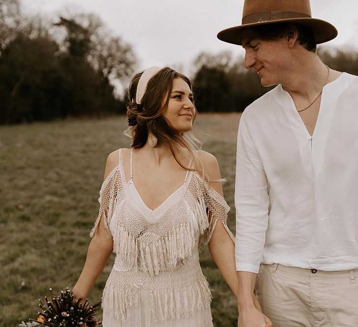 Boho Couple with Bride in Fringe Wedding Dress and Groom in Casual Shirt and Chino's