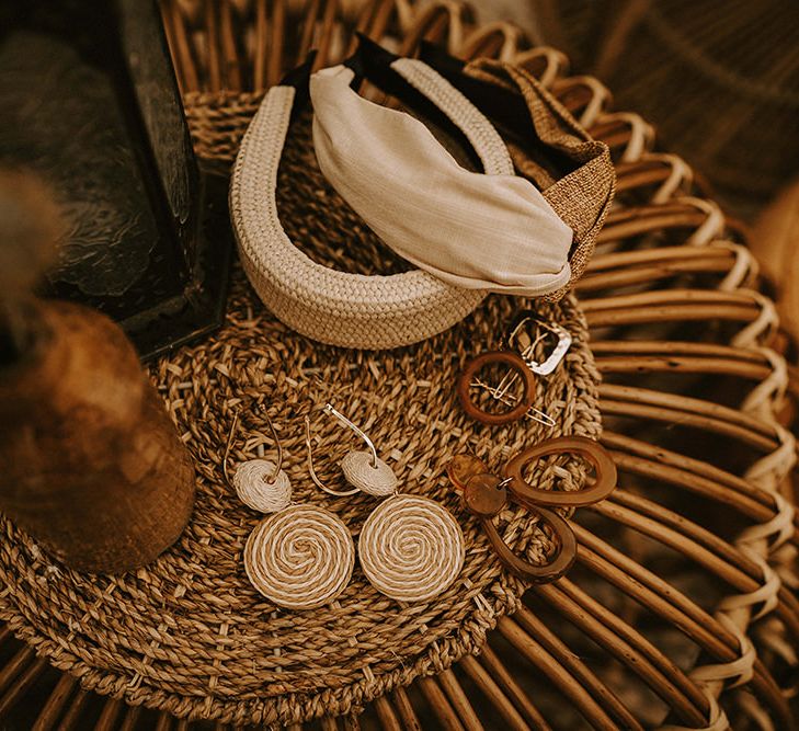 Bridal Accessories and Earrings on Wicker Table