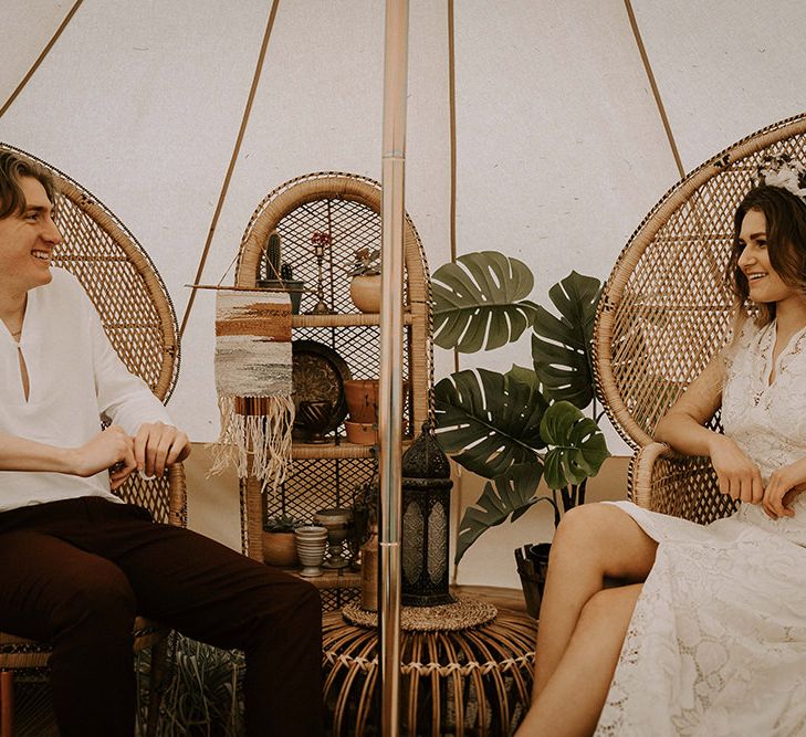 Boho Bride and Groom Relaxing in Peacock Chairs