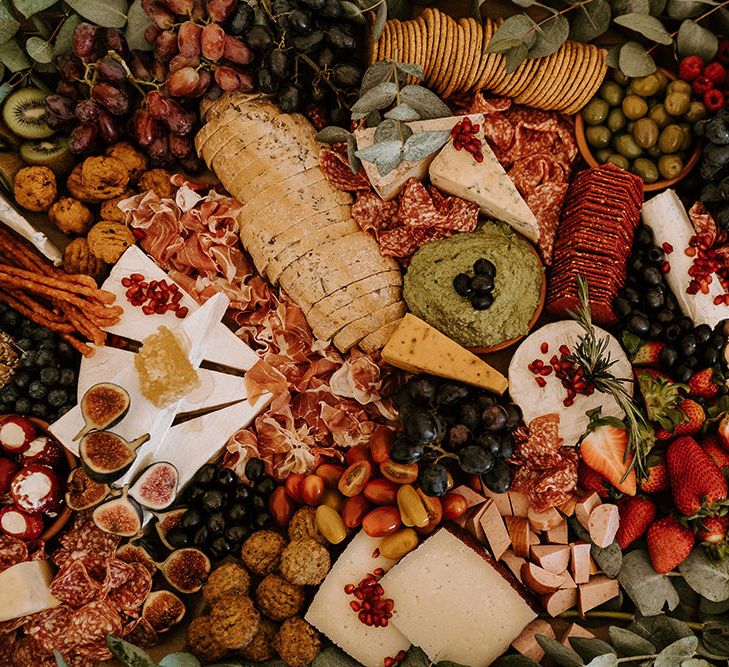 Grazing Board with a Mixture of Bread, Cheese, Crackers, Fruits and Vegetables