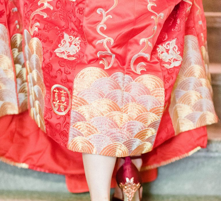 Chinese Tea Ceremony Wedding Bride in Traditional Chinese Red Dress and Red and Gold Shoes