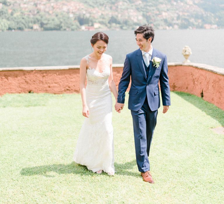 Bride in Fitted Anna Kara Wedding Dress and Groom in Navy Suit