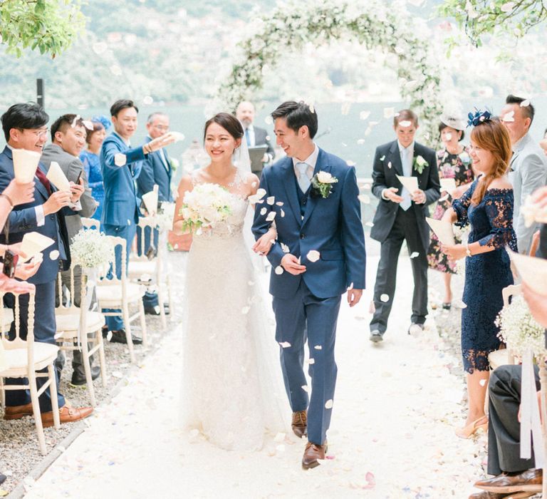 Confetti Exit at Outdoor Wedding Ceremony with Bride in Fitted Anna Kara Wedding Dress and Groom in Navy Suit