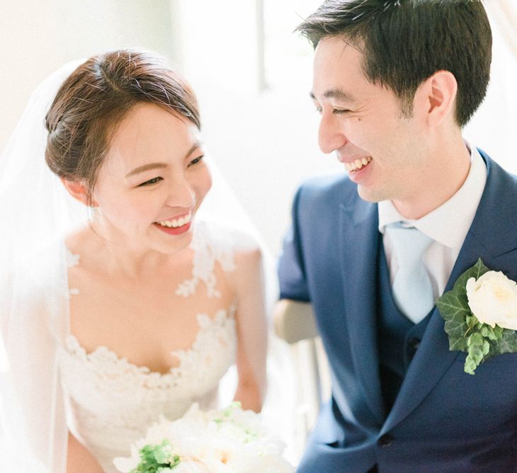 Happy Bride in Anna Kara Wedding Dress and Groom in Three-piece Navy Wedding Suit