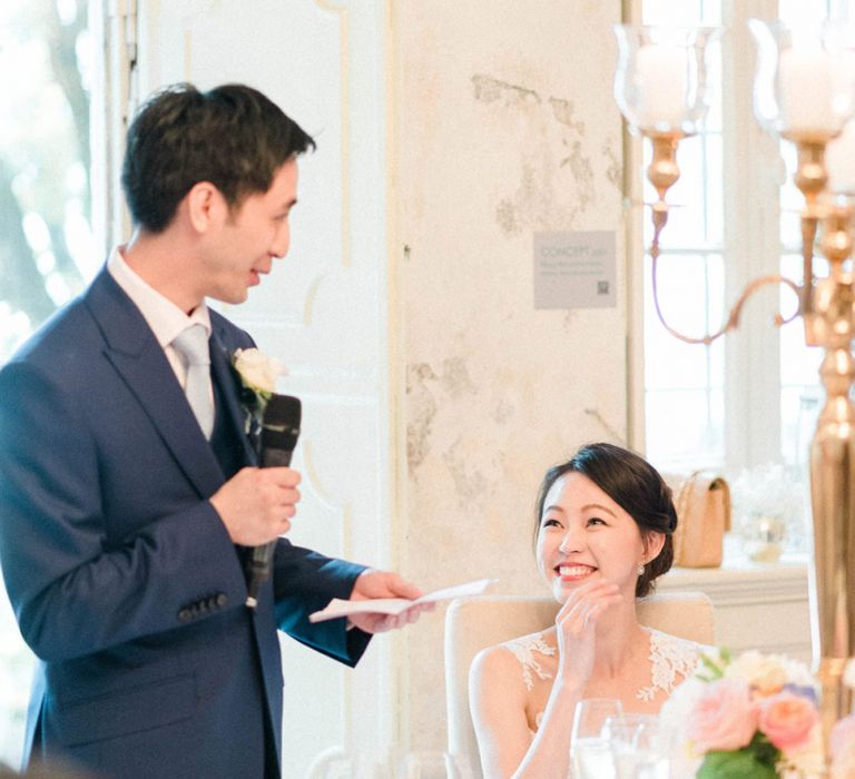 Groom in Three-piece Navy Wedding Suit Giving His Wedding Speech