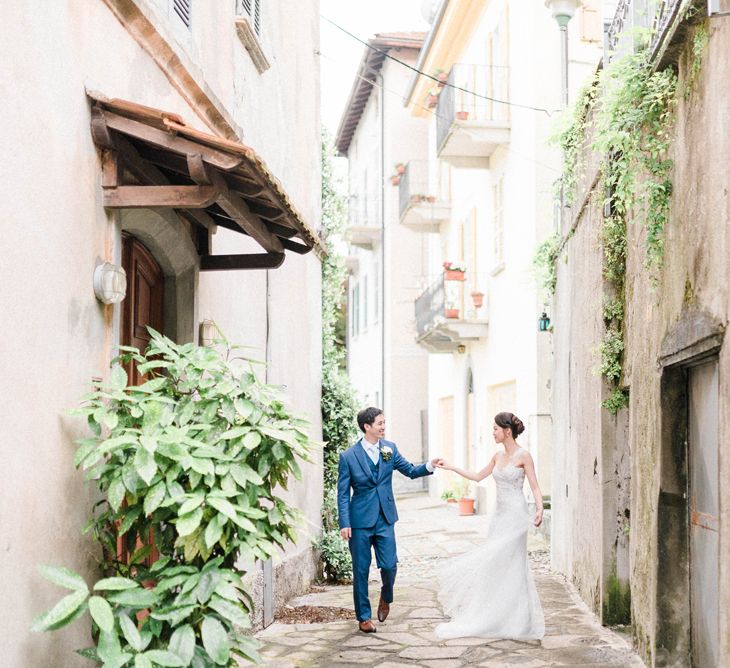 Bride in Anna Kara Wedding Dress and Groom in Three-piece Navy Wedding Suit