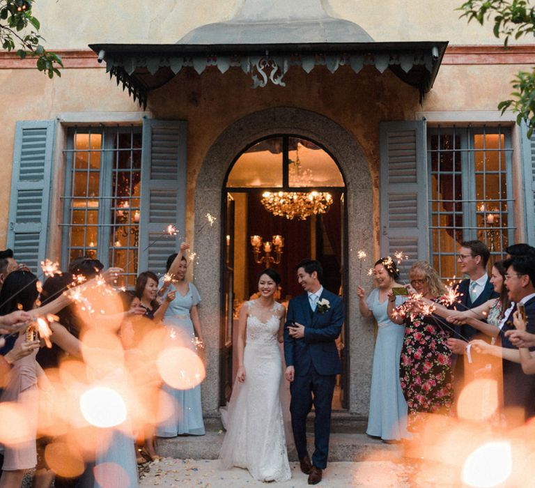 Sparkler Exit with Bride in Anna Kara Wedding Dress and Groom in Three-piece Navy Wedding Suit