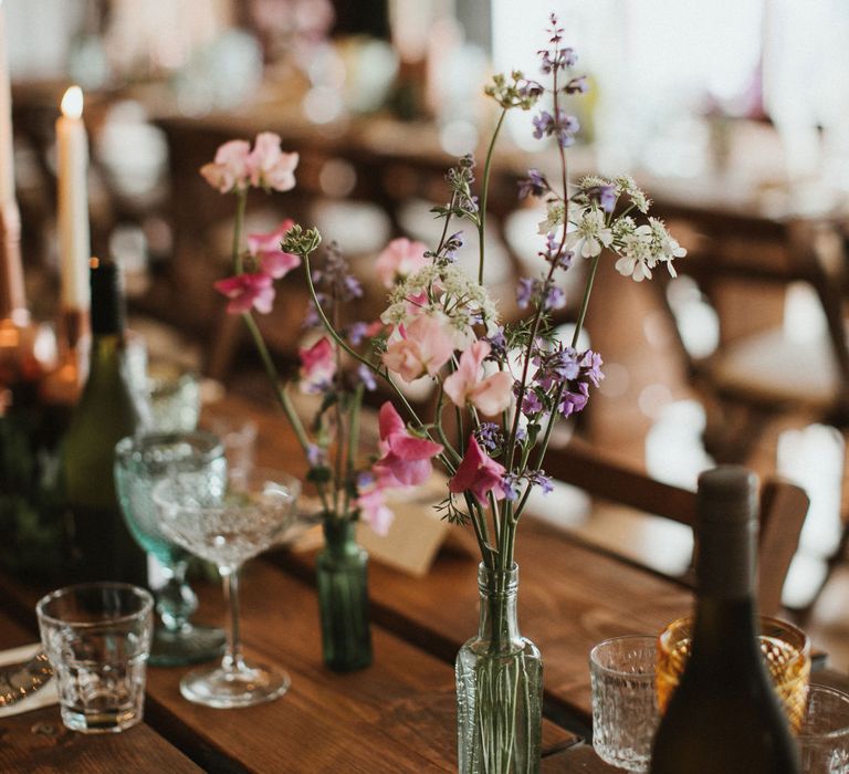 Wooden Trestle Tables With Copper Painted Bottles &amp; Ivory Tapered Candles // James Frost Photography