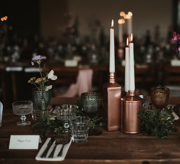 Wooden Trestle Tables With Copper Painted Bottles &amp; Ivory Tapered Candles // James Frost Photography