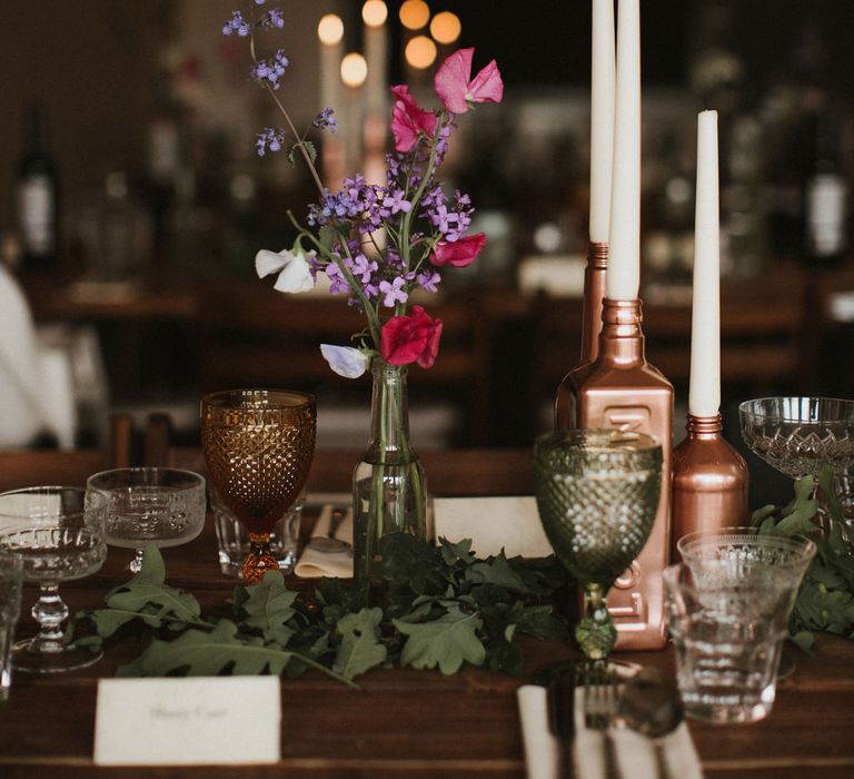 Wooden Trestle Tables With Copper Painted Bottles &amp; Ivory Tapered Candles // James Frost Photography