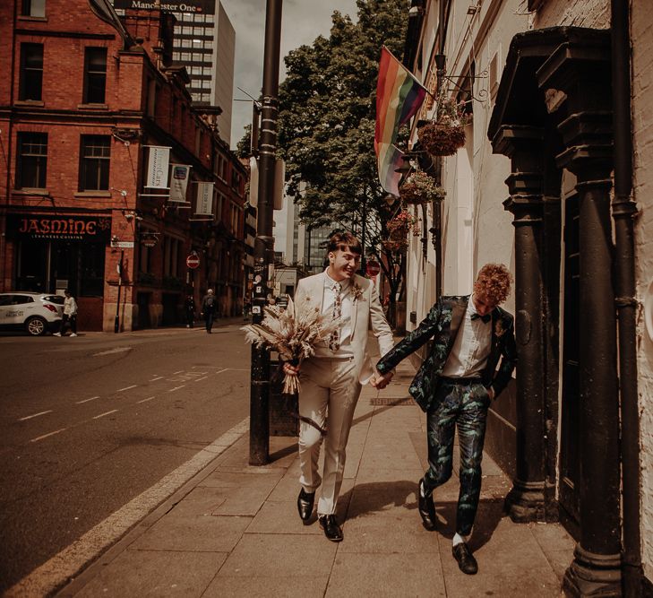 Gay couple in patterned and beige suits at Manchester elopement