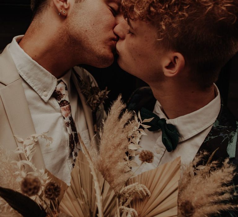 Gay couple kissing at elopement