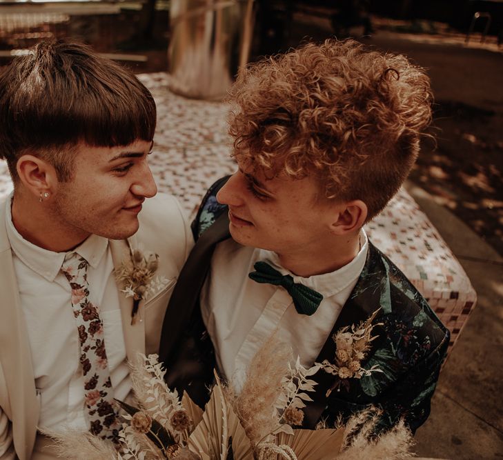 Grooms in patterned suit and ties at city elopement