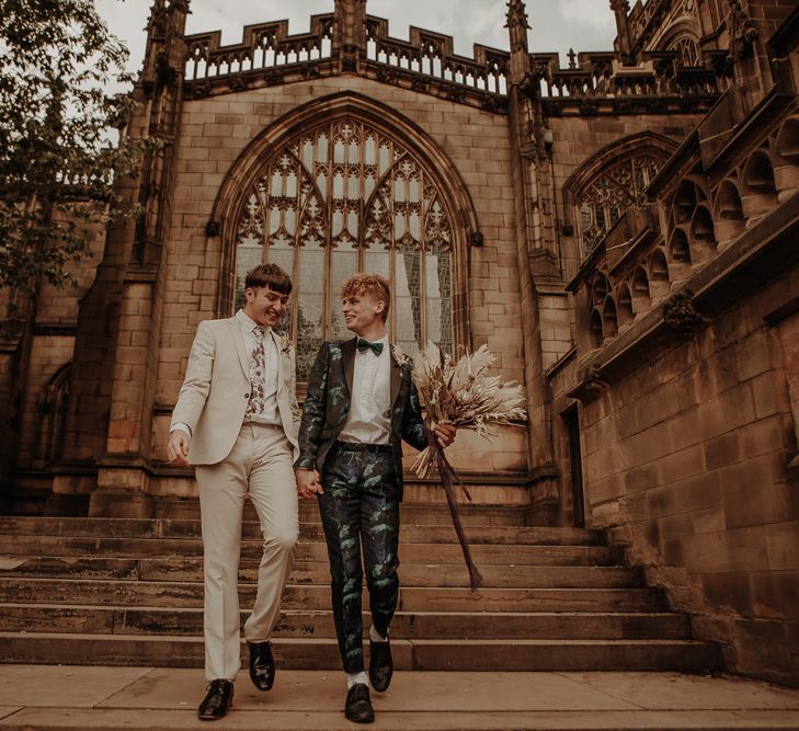 Two grooms walking down the church steps as husband and husband at Manchester elopement