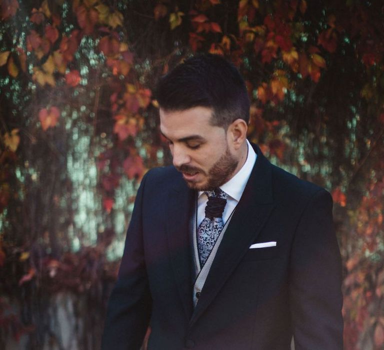 Groom in Señor Suit with Paisley Print Cravat and Waistcoat