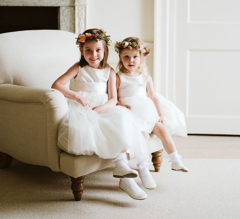 Flower Girls In White Dresses With Flower Crowns // Image By John Barwood Photography