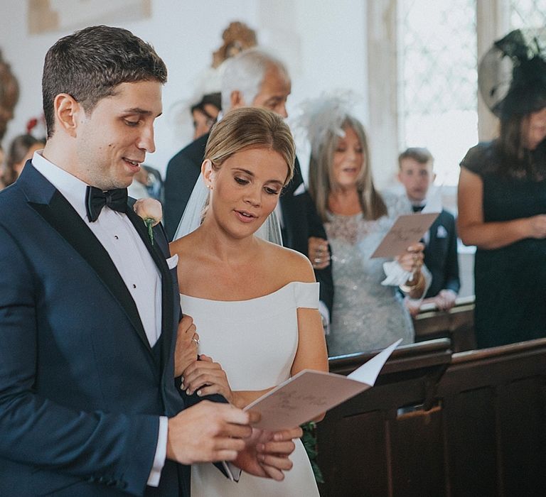 Church Wedding Ceremony | Bride in Suzanne Neville Bardot Nouveau Wedding Dress | Groom in Black Tie | Pastel Pink &amp; Mint Green Wedding at Granary Estates Suffolk | Julia &amp; You Photography