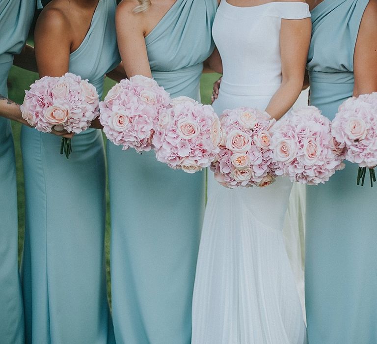 Bridal Party Pink Rose Bouquets | Bridesmaids in Mint Green One Shoulder Vivie-Grace by Jayde Spicer | Bride in Suzanne Neville Bardot Nouveau Wedding Dress | Pastel Pink &amp; Mint Green Wedding at Granary Estates Suffolk | Julia &amp; You Photography