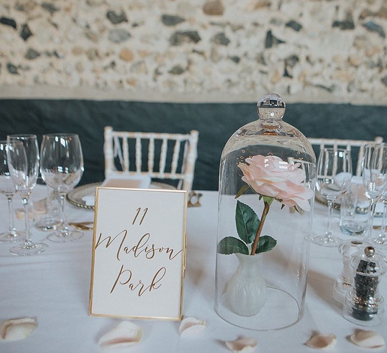 Gold Foil Wedding Stationery Table Name Card | Single Rose Flower Stem Under a Cloche | Sleeping Beauty Inspired Centrepiece | Pastel Pink &amp; Mint Green Wedding at Granary Estates Suffolk | Julia &amp; You Photography