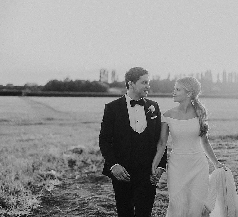 Bride in Suzanne Neville Bardot Nouveau Wedding Dress | Groom in Black Tie | Pastel Pink &amp; Mint Green Wedding at Granary Estates Suffolk | Julia &amp; You Photography