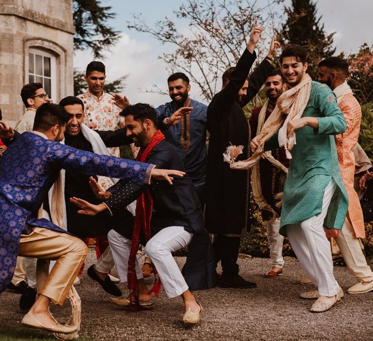 Indian wedding guests dancing outside Elmore Court