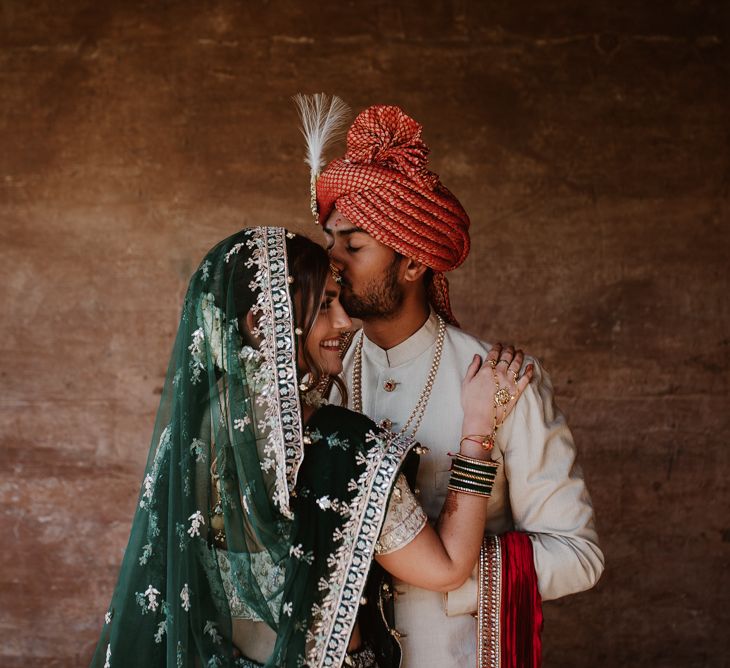 Bride in green and gold sari