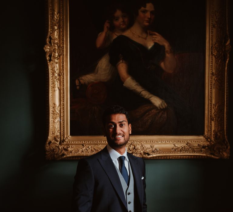 Groom in three-piece wedding suit at civil wedding ceremony