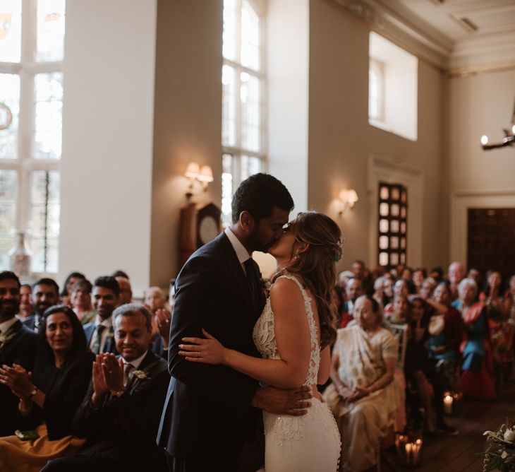 Bride and groom kissing at civil wedding ceremony