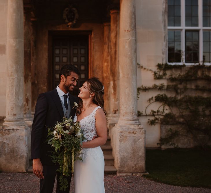 Bride and groom portrait outside Elmore Court wedding venue